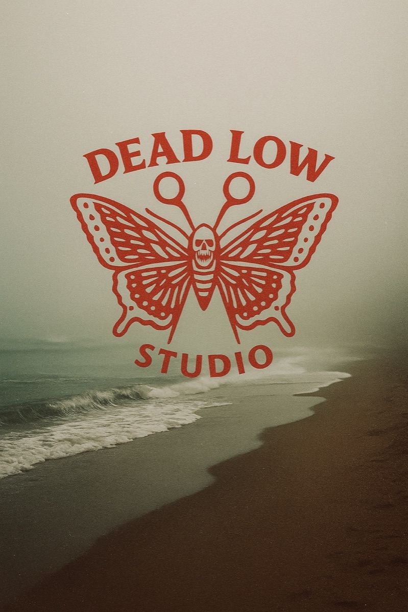 Dead Low Studio butterfly mark over the Ocean City shore